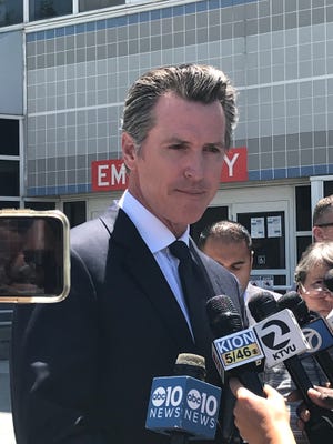 California Governor Gavin Newsom speaking at a news conference in front of Santa Clara Valley Medical Center in San Jose, California. The governor spoke on the shooting at the Gilroy Garlic Festival on Sunday, July 28, 2019.