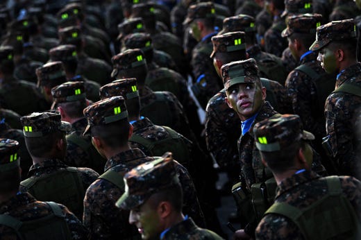 Some of 1,000 soldiers joining the Salvadoran Armed Forces remain at Gerardo Barrios square in the historical center of San Salvador, on July 29, 2019, to be reviewed by Salvadoran President Nayib Bukele.