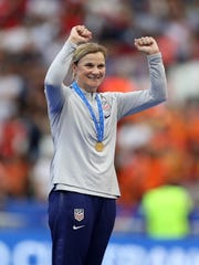 Jill Ellis celebrates after winning the World Cup in France.