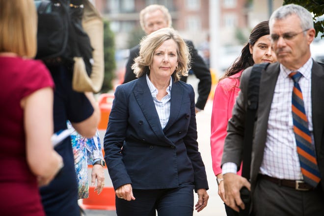 Former Buncombe County Commissioner Ellen Frost approaches the Charles R. Jonas Federal Building with her attorney, Tony Scheer, for her first court appearance since being indicted on federal fraud and conspiracy charges on July 31, 2019 in Charlotte. Frost plead not guilty to the charges and Scheer says they intend to take the case to trial.  