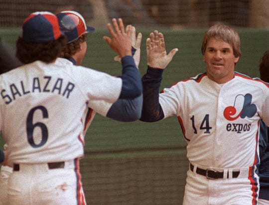 Montreal Expos Pete Rose in congratulated by teammates Gary Carter and Argenis Salazar following his 4000th career hit during the Expo's home opener on April 13, 1984 against the Philadelphia Phillies.