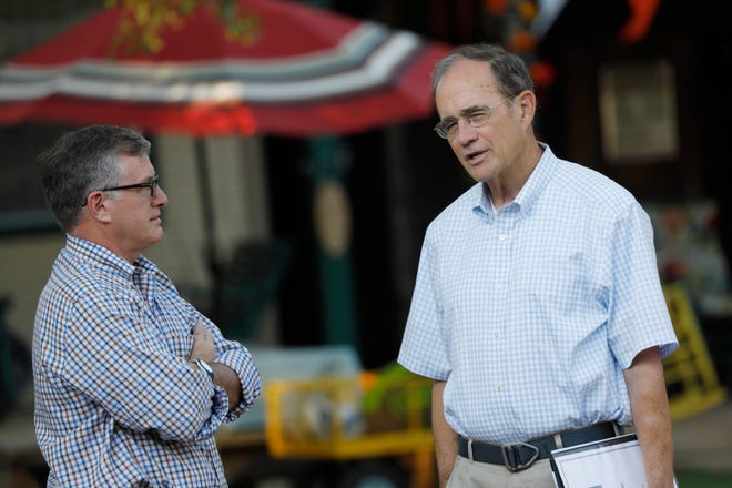 Rep. Jay Hughes, D-Oxford, left, and Republican Secretary of State Delbert Hosemann, confer at the Neshoba County Fair in Philadelphia, Miss., Wednesday, July 31, 2019. The two are seeking their respective parties nominations for lieutenant governor, and both spoke at the Fair. Candidates running in party primaries for statewide offices and district posts take advantage of the large gathered crowd at the fair who attend for the speeches.