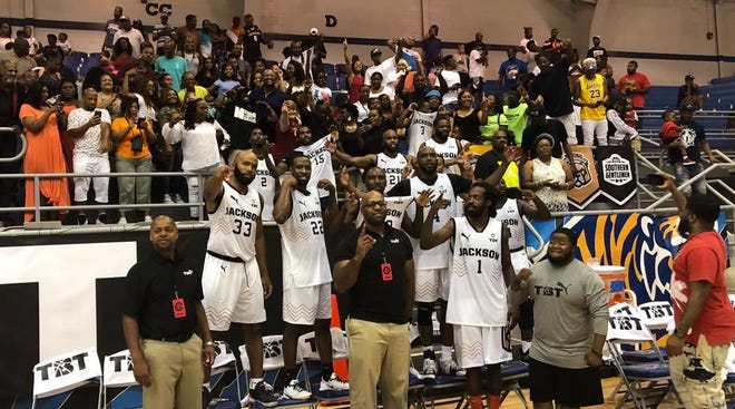 The Jackson Underdawgs celebrate after winning the Memphis region of the 2019 The Basketball Tournament.