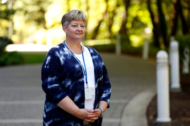 Ann-Marie Bandfield, program manager at the Psychiatric Crisis Center, poses for a photo near her office in Salem, Oregon, on Tuesday, July 30, 2019. Bandfield has worked at the center for 25 years.