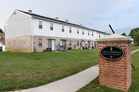 In this Monday, July 29, 2019, photo, townhouses stand at The Commons at White Marsh, owned by the Kushner Cos., in Middle River, Md.