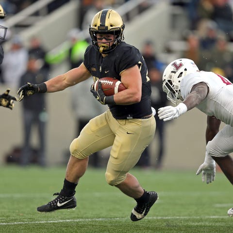 Army running back Connor Slomka carries the ball...
