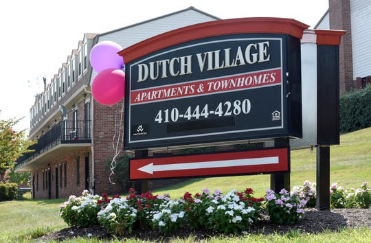 In this Monday, July 29, 2019, photo, a sign sits outside the Dutch Village apartments and townhomes, owned by the Kushner Cos., in Baltimore.