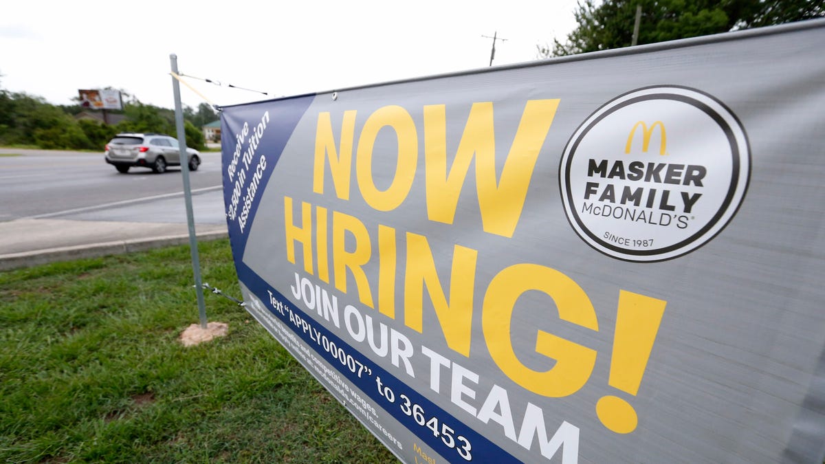 FILE - In this June 21, 2019, file photo a now hiring sign is displayed to attract potential workers at a McDonald's restaurant in Moss Point, Miss. On Wednesday, July 31, payroll processor ADP  reports on how many jobs its survey estimates U.S. companies added in July. (AP Photo/Rogelio V. Solis, File)