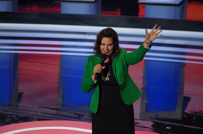 Michigan Governor Gretchen Whitmer takes the stage before the first night of the Democratic presidential debates at the Fox Theatre in Detroit on Tuesday, July 30, 2019.