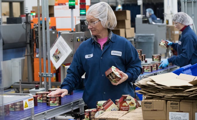 Kathy Griffey works on a line packaging Balanced Breaks snacks at Sargento Foods Inc. in Hilbert.