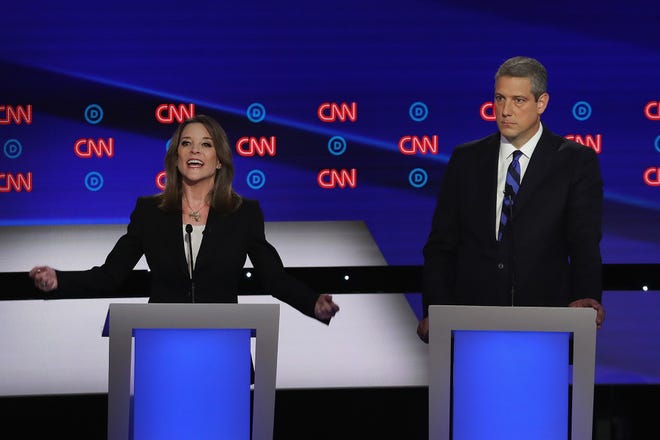 Democratic presidential candidate Marianne Williamson speaks while Rep. Tim Ryan (D-Ohio) listens during the Democratic Presidential Debate at the Fox Theatre in Detroit on Tuesday, July 30, 2019. (Justin Sullivan/Getty Images/TNS) **FOR USE WITH THIS STORY ONLY**