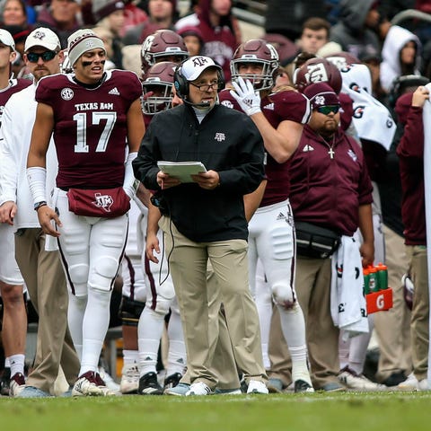 Texas A&M coach Jimbo Fisher looks on from the...