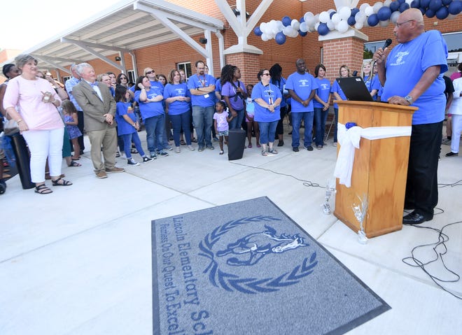 Fifth grade math teacher Steve Webster gives remarks during the grand opening of the new Lincoln Elementary School on  Friday, Aug. 2. The building, which is partially inside the old Whitehall Pre-K, has been renovated with a new wing. Classes begin Aug. 5.