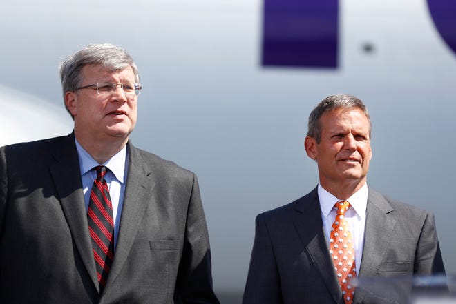 Memphis Mayor Jim Strickland, a Democrat who is seeking a second term in this year's nonpartisan city elections, has been criticized for reaching across the aisle. He's shown here at an economic development announcement with Republican Gov. Bill Lee.