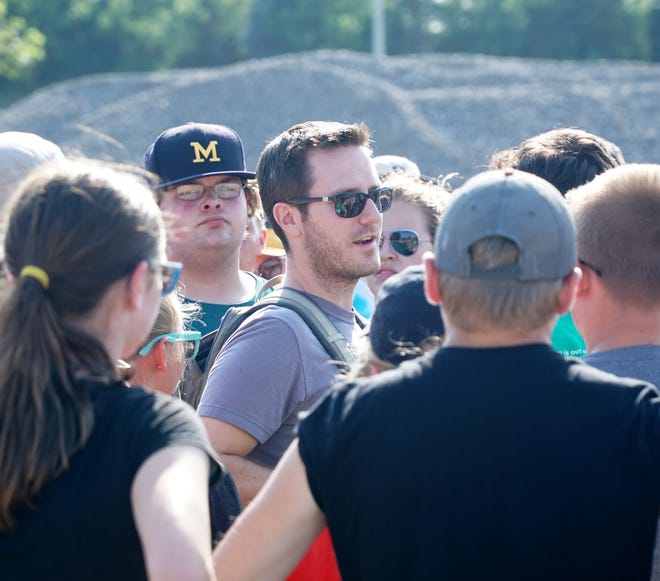 New Plymouth-Canton marching band director Mike Wells talks to his troops during an Aug. 2 rehearsal for the upcoming season.