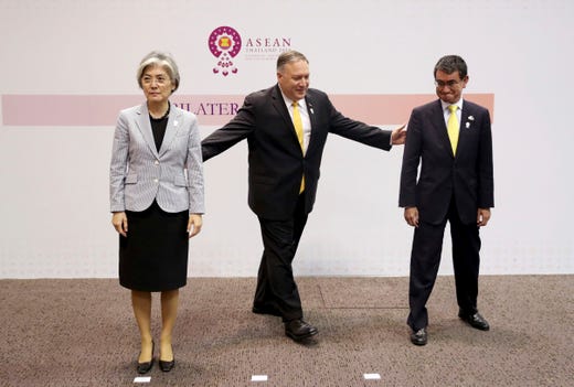 U.S. Secretary of State Mike Pompeo, center, gestures to his Japanese counterpart Taro Kono, right, and South Korean counterpart Kang Kyung-wha after a trilateral meeting on the sidelines of the ASEAN and dialogue partners foreign ministers' meeting in Bangkok, Thailand, Aug. 2, 2019.