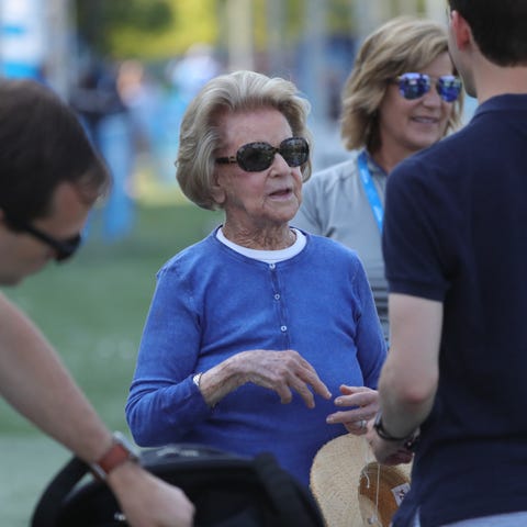 Martha Firestone Ford talks with family members at