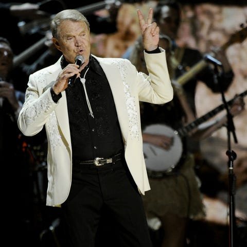 Glen Campbell performs "Rhinestone Cowboy" during 