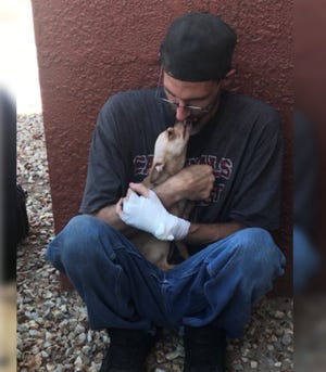 Bubba, safe and sound after Phoenix firefighters restored his breath.