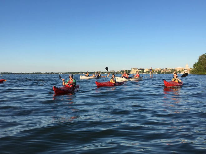 The Glow Float is a popular sunset paddle on Lake Mendota with the Natural Resources Foundation's Wayfarers group.