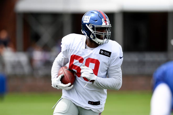New York Giants' Terrence Fede runs with the ball during training camp on Monday, August 5, 2019, in East Rutherford.