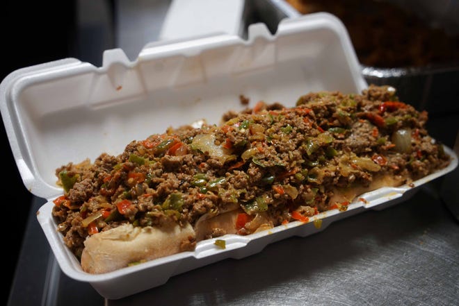 A three-pound Chef Philly Cheesesteak sandwich created by Clint "Chef Bones" Harris, owner of TenderBones Rib Shack in Bear, rest in a box. The cheesesteak cost $18 and is a special request only item that's not on the menu.
