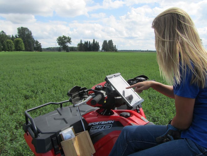 An AgSource Laboratory NMP/GPS Technician scouts a field.