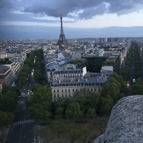 The Eiffel Tower and the rooftops of Paris at...