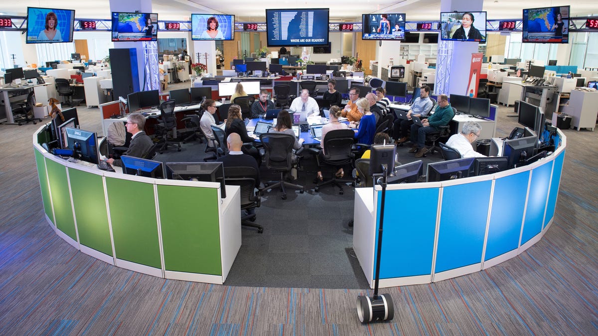 Staff gathers in the USA TODAY newsroom during a morning news meeting.