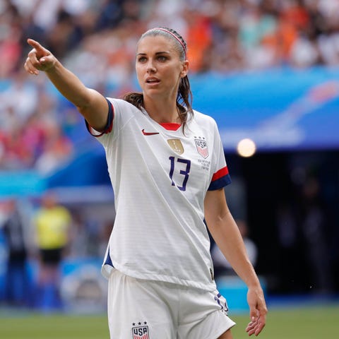 U.S. forward Alex Morgan gestures during her...