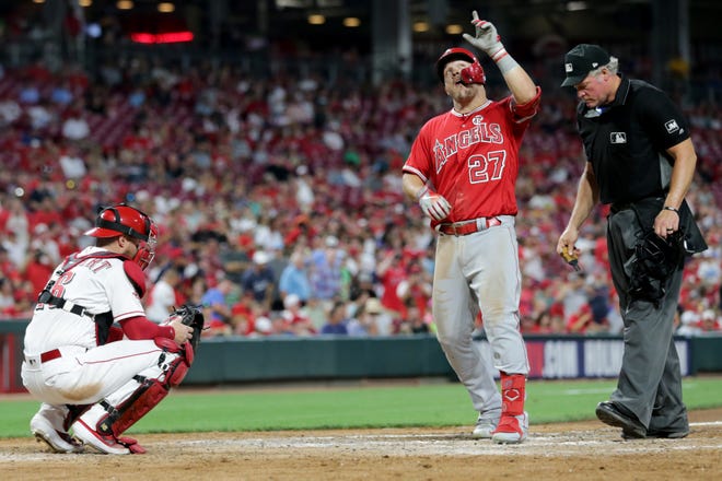 Los Angeles Angels center fielder Mike Trout (27) celebrates after hitting a solo home run in the sixth inning of an MLB baseball game against the Cincinnati Reds, Monday, Aug. 5, 2019, at Great American Ball Park in Cincinnati. 