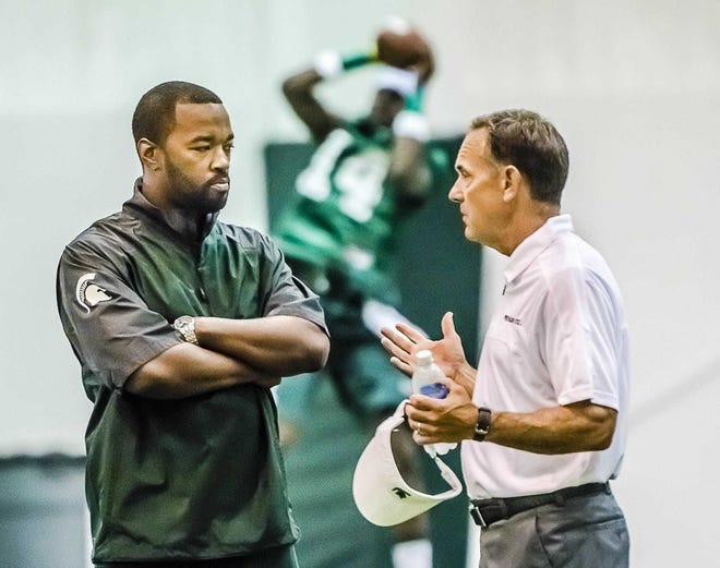 Detroit native Curtis Blackwell, left, was hired by MSU football coach Mark Dantonio on Aug. 2, 2013. Blackwell's contract was not renewed in May 2017 and he later sued Dantonio and other university officials.