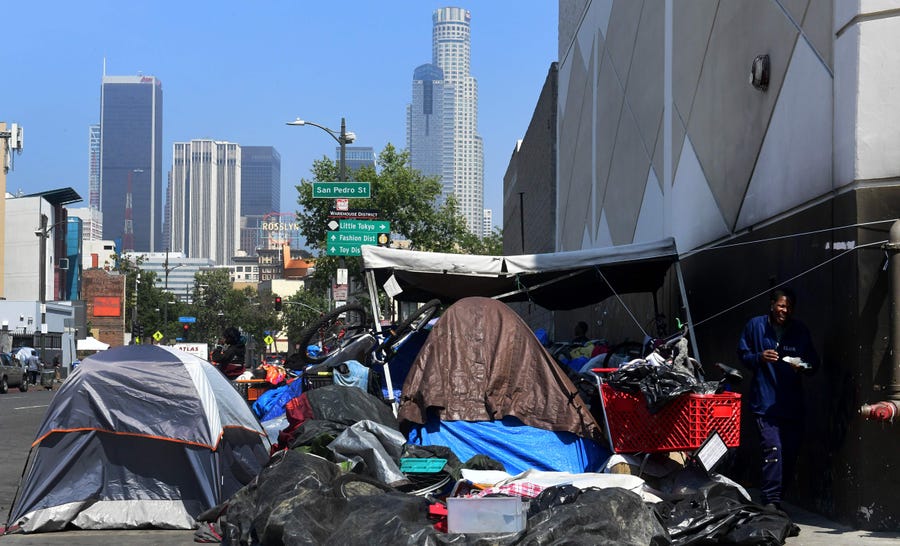 Belongings of the homeless crowd a downtown Los Angeles sidewalk in Skid Row on May 30, 2019.
