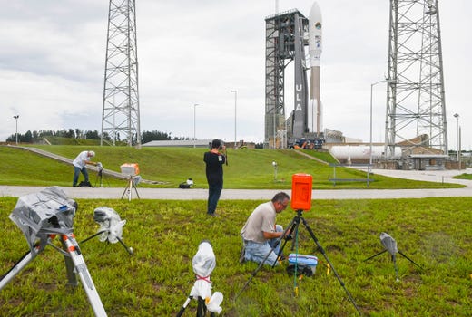 Photographers set up remote cameras in advance of tonight's launch of a United Launch Alliance Atlas V rocket from Cape Canaveral Air Force Station. The rocket is carrying the AEHF 5 communications satellite for the U.S. military.