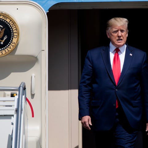 President Donald Trump steps off Air Force One at...