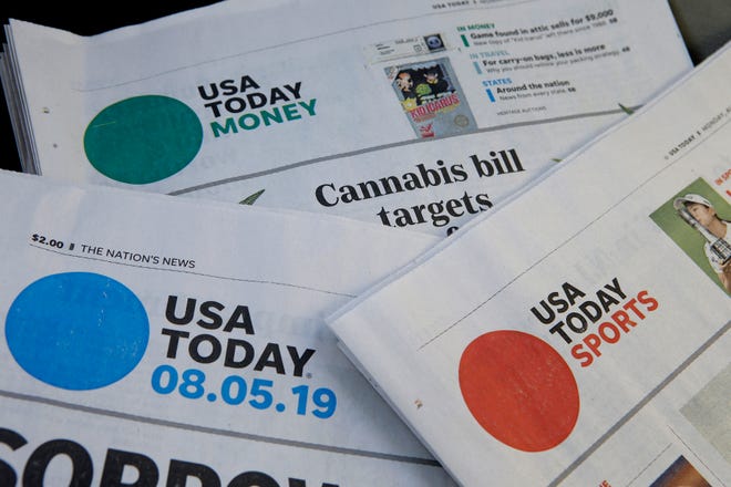 Sections of a USA Today newspapers rest together, Monday, Aug. 5, 2019, in Norwood, Mass.