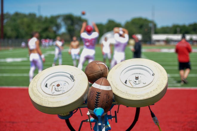 The University of South Dakota football team practices on Wednesday, August 7, on the practice field near the Dakotadome in Vermillion. 