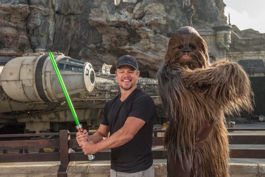 Matt Damon meets Chewbacca in front of Millennium Falcon: Smugglers Run before taking the controls of the ride.