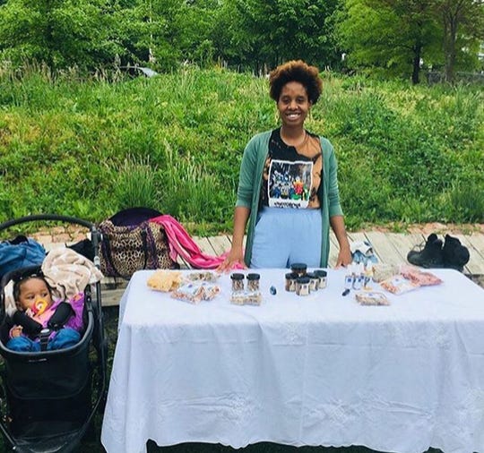 Claire Alcindor is shown selling her herbal skin care products at the Whitelock Community Farm in Baltimore, Md. Alcindor used marijuana to ease nausea and depression symptoms during the pregnancy.