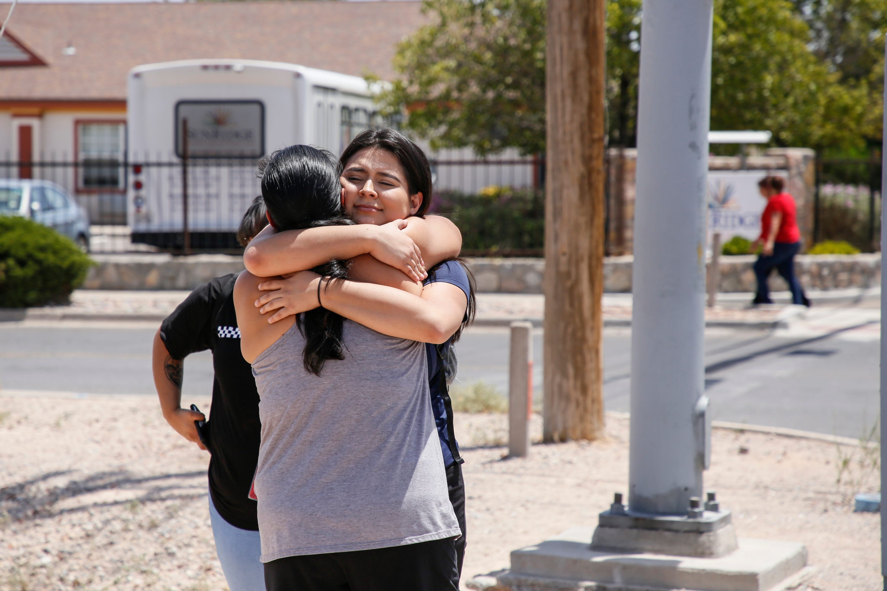 Tabitha Estrada, 19, hugs her mother Rebeca Rivas, 40, an hour after being trapped in a Walmart in El Paso during a mass shooting on Saturday, Aug. 3, 2019.