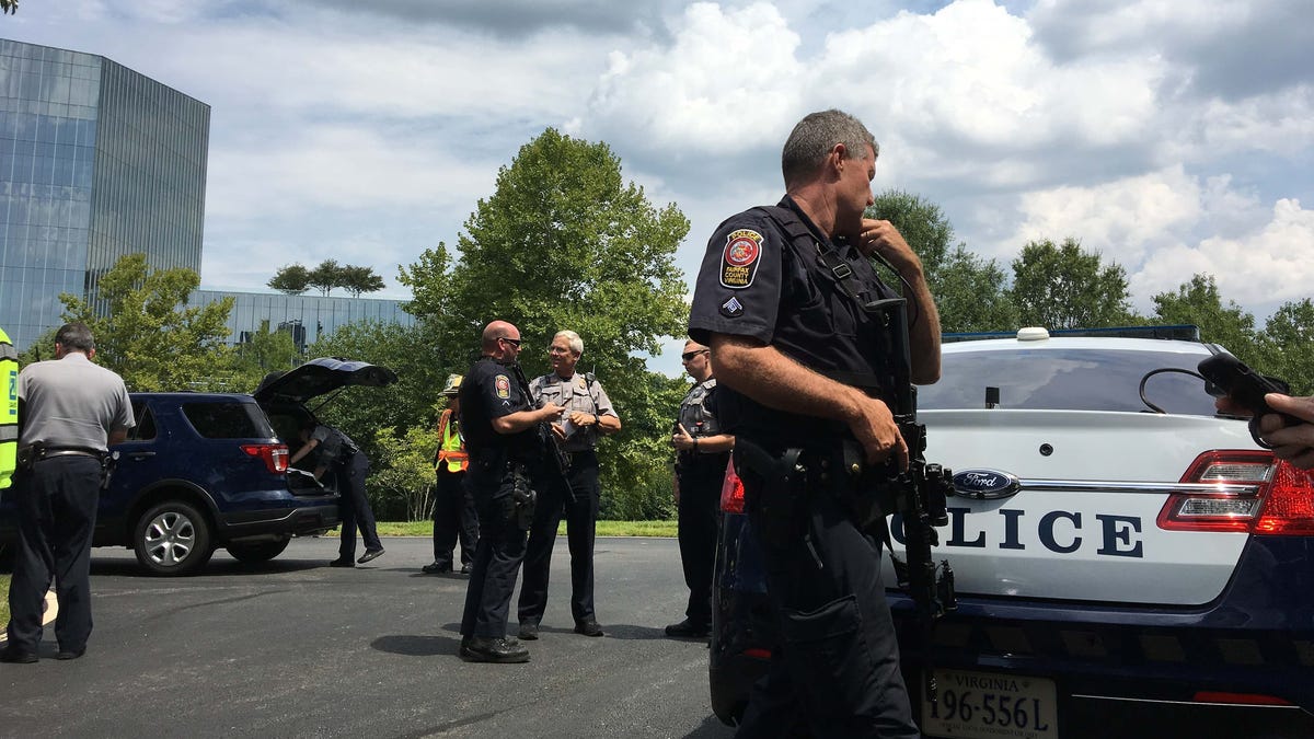 USA TODAY headquarters were evacuated after police reported a man with a weapon at the building in suburban Washington, DC. Authorities said the incident turned out to be a mistaken report of a person with a weapon.