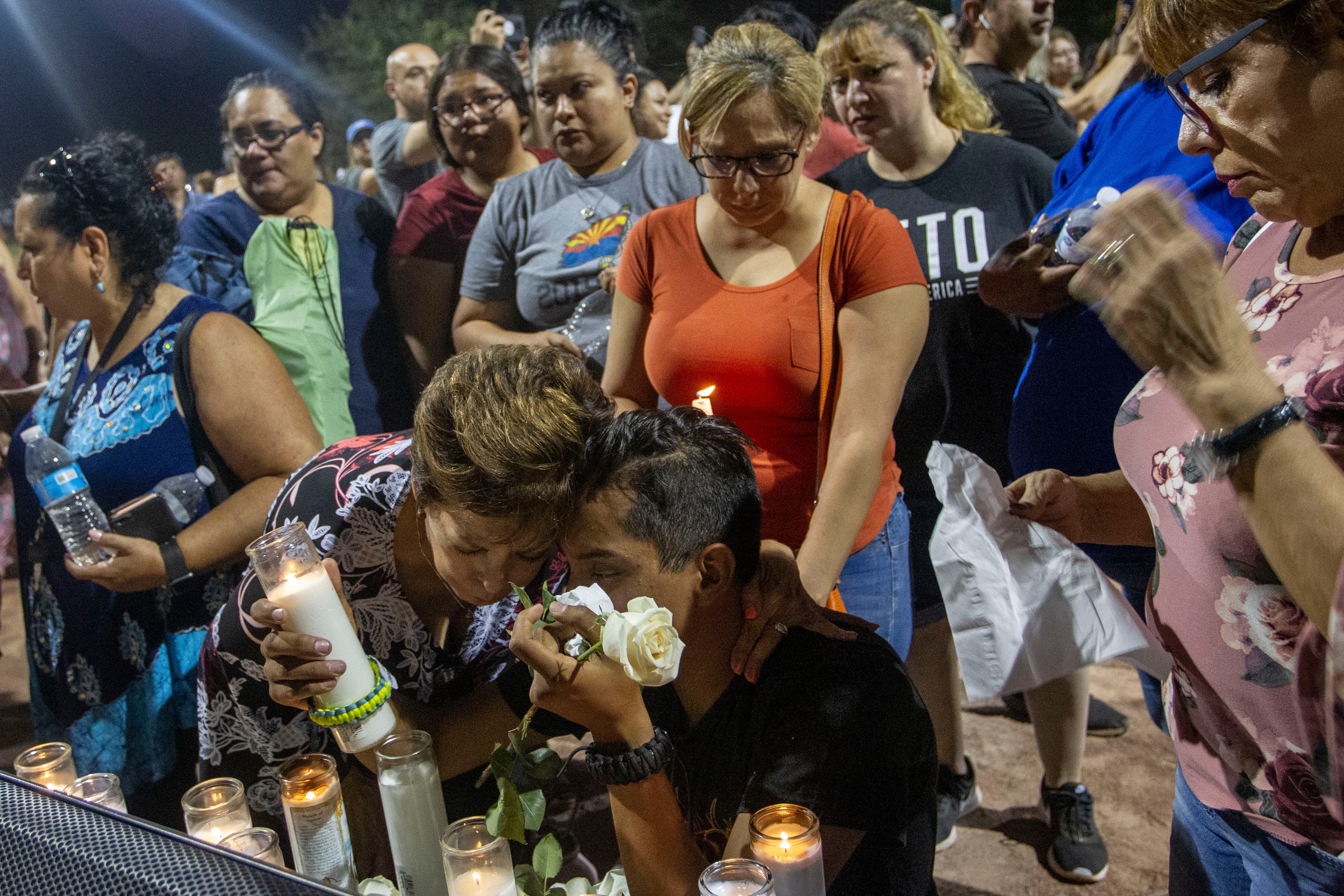 Manuel Diaz mourns the loss of his cousin, Armis Ramirez, 15, during a vigil Sunday, Aug. 4, 2019, at Ponder Park in El Paso.