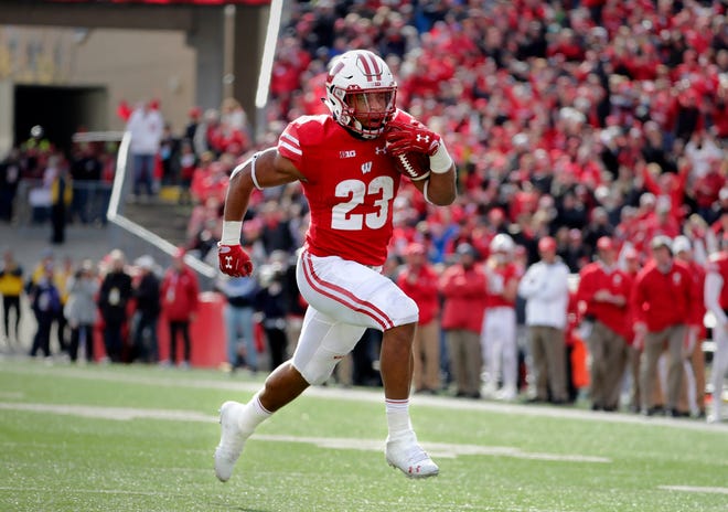 UW running back Jonathan Taylor breaks away for a touchdown in the second half during Wisconsin's 31-17 win over Rutgers at Camp Randall Stadium in Madison last Nov. 3.