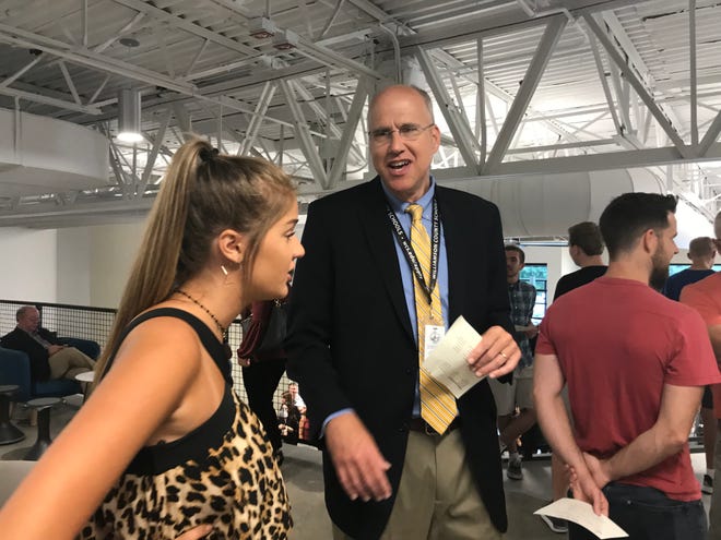Williamson County Schools Superintendent Jason Golden talks with Marlee Conner, student body president of Summit High School, at the Entrepreneurship and Innovation Center grand opening.