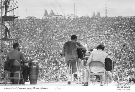 This August, 1969 photo shows Richie Havens as he performs during Woodstock in Bethel, N.Y. The photo is only one of hundreds made by photographer Mark Goff who, at the time, worked for an underground newspaper in Milwaukee, Wis. Some were published, but the negatives were filed away at his Milwaukee home and barely mentioned as Goff raised two daughters, changed careers and, last November, died of cancer. Dozens of Goff's Woodstock shots are being displayed 50 years later.