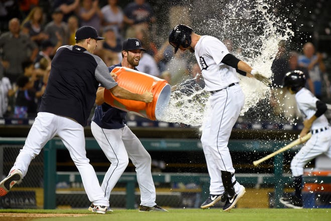 Detroit Tigers pitchers Matthew Boyd, left, and Daniel Norris throw water onto Jordy Mercer after he hit a two-run, walk-off home run against the Kansas City Royals in the ninth inning on Thursday.