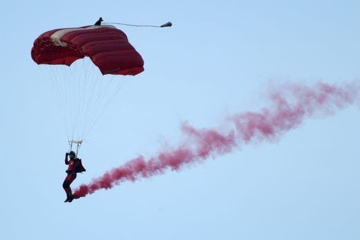 A member of the Red Lions parachute team takes part in the 54th National Day Parade in Singapore on August 9, 2019.