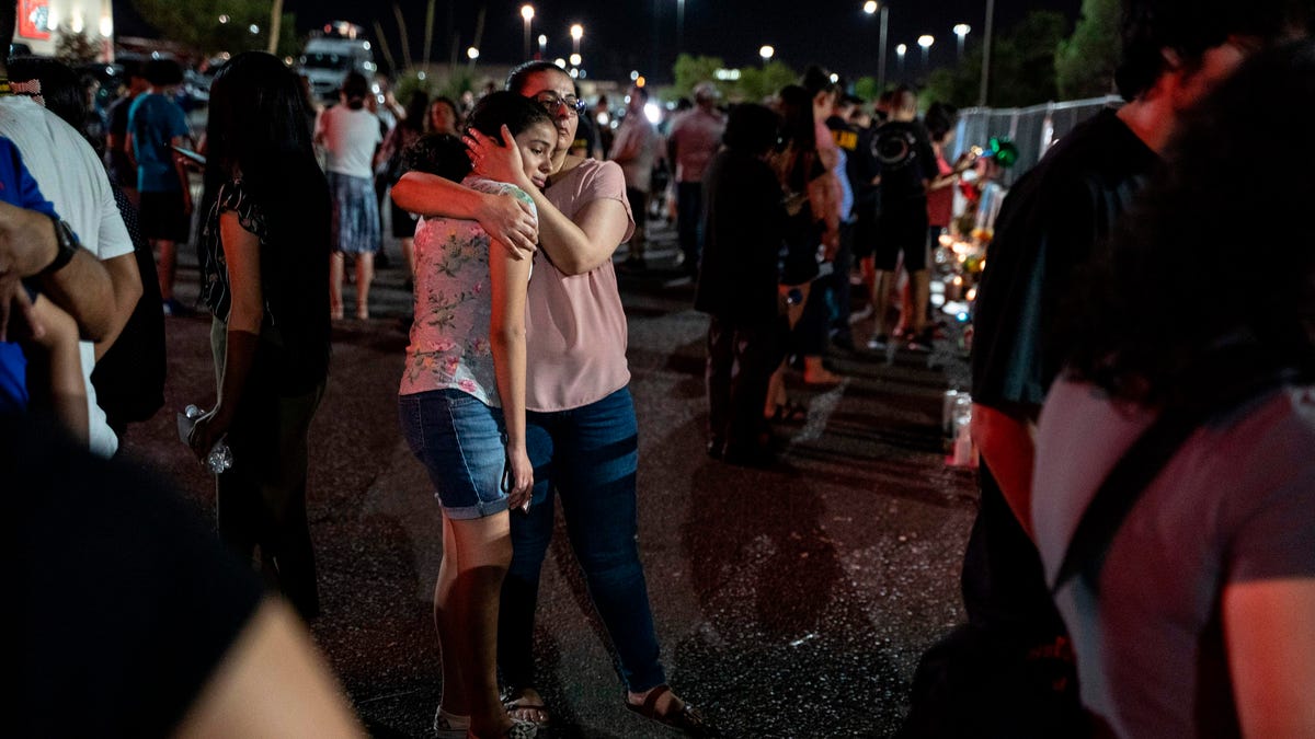Locals of El Paso visit the memorial for shooting victims at the Cielo Vista Mall Walmart in El Paso, Texas on August 8, 2019.