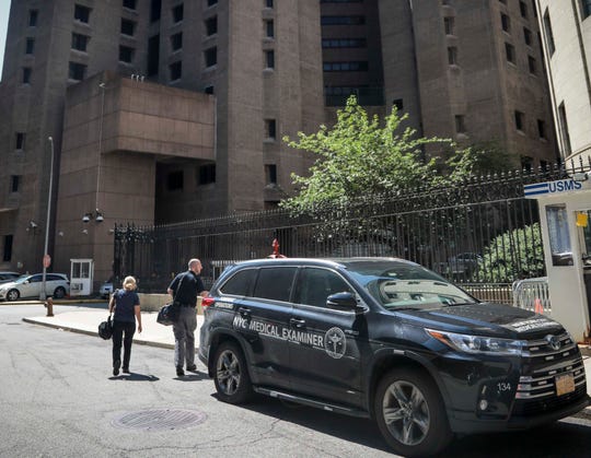 New York City medical examiner personnel leave their vehicle and walk to the Manhattan Correctional Center where financier Jeffrey Epstein died by suicide while awaiting trial on sex-trafficking charges, Saturday Aug. 10, 2019, in New York.
