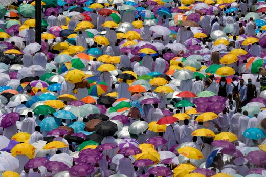 Muslim pilgrims pray outside the Namirah mosque at Mount Arafat, also known as Jabal al-Rahma (Mount of Mercy), southeast of the Saudi holy city of Mecca, as the climax of the Hajj pilgrimage approaches on Aug. 10, 2019. Arafat is the site where Muslims believe the Prophet Mohammed gave his last sermon about 14 centuries ago after leading his followers on the pilgrimage. The ultra-conservative kingdom, which is undergoing dramatic social and economic reforms, has mobilized vast resources for the six-day journey, one of the five pillars of Islam.